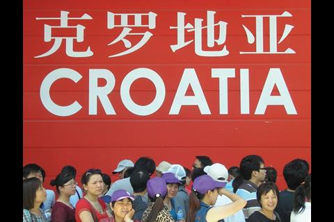 Tourists queueing outside the Croatia pavilion.